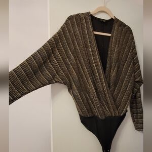 Gold shimmery body suit.